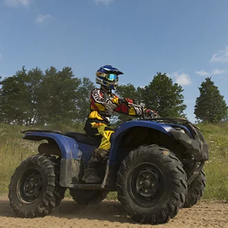 Person on an ATV on a dirt path