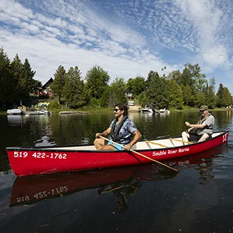 Two people in a canoe on a river